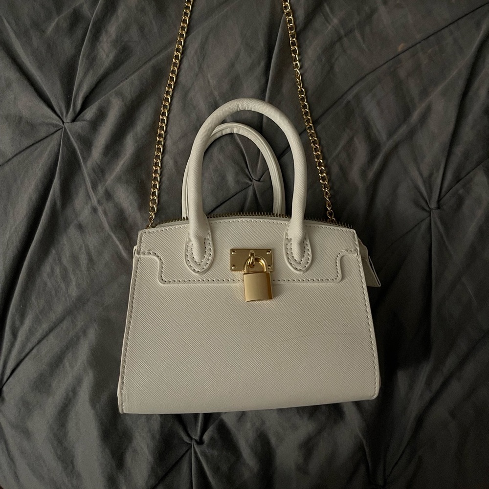 I am selling a leather white mini purse.